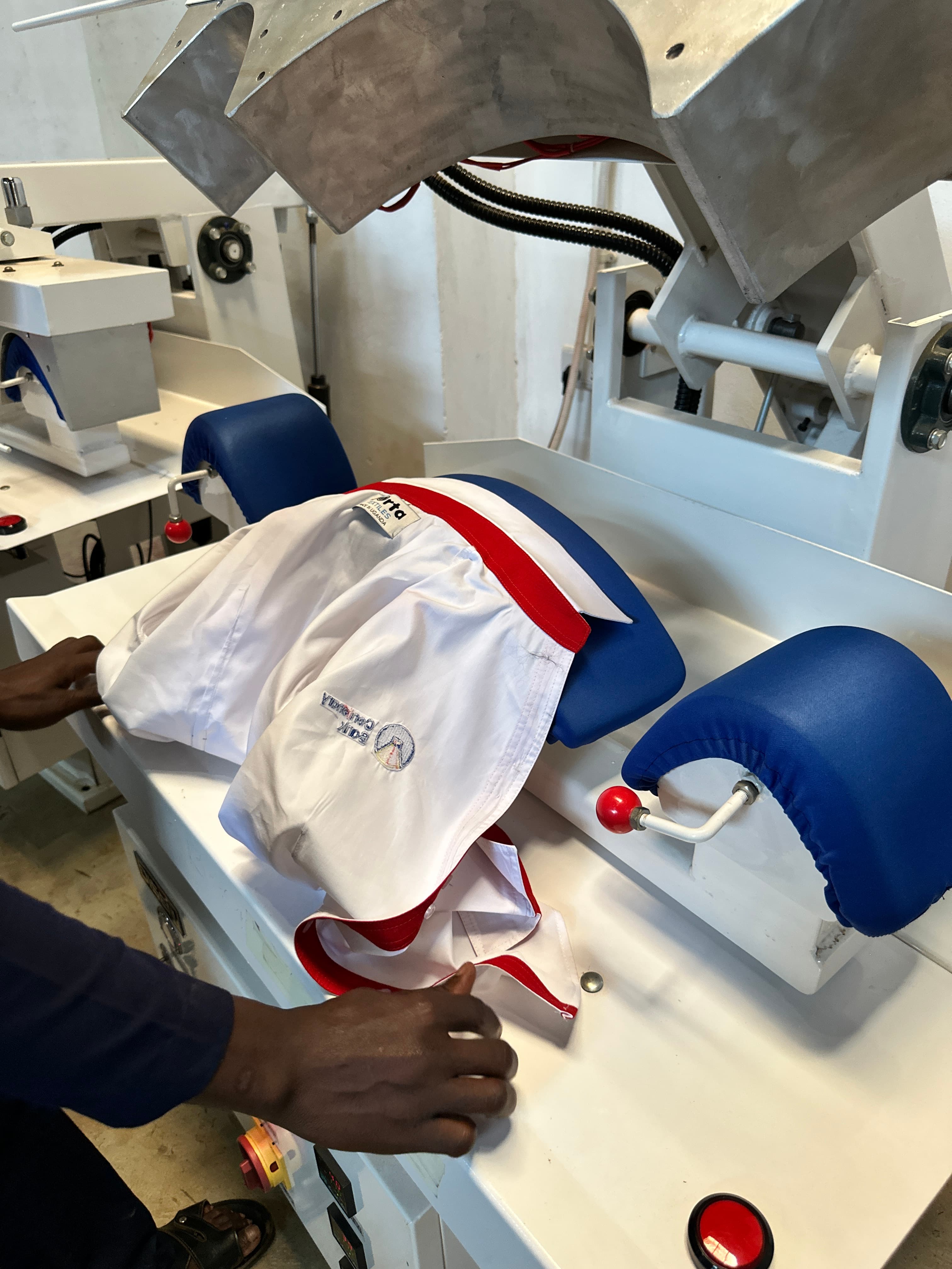 Dorta team member finishing a garment with production equipment